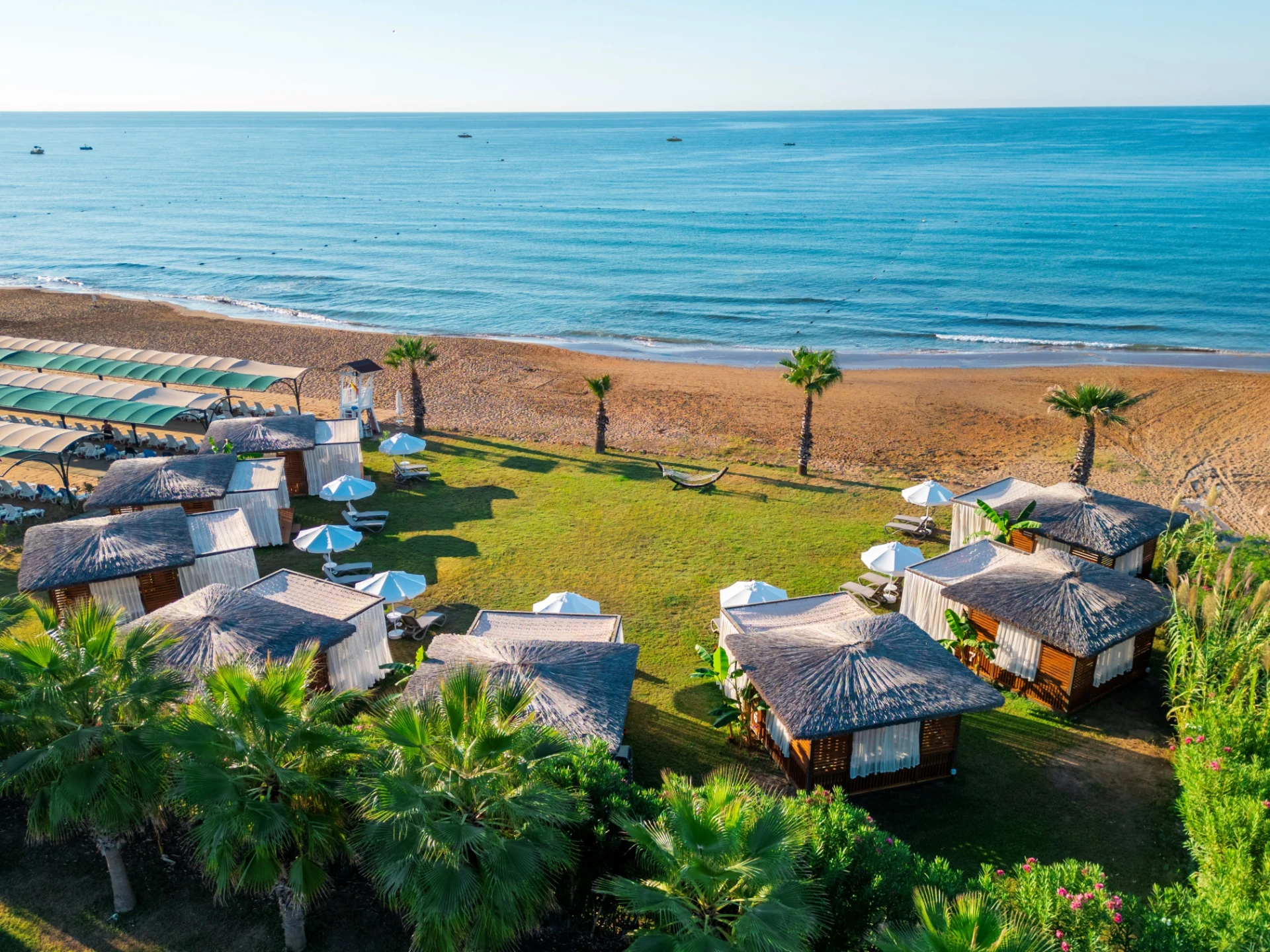 Beachfront cabanas by the Mediterranean shore